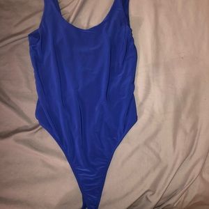 Royal blue sleeveless bodysuit.